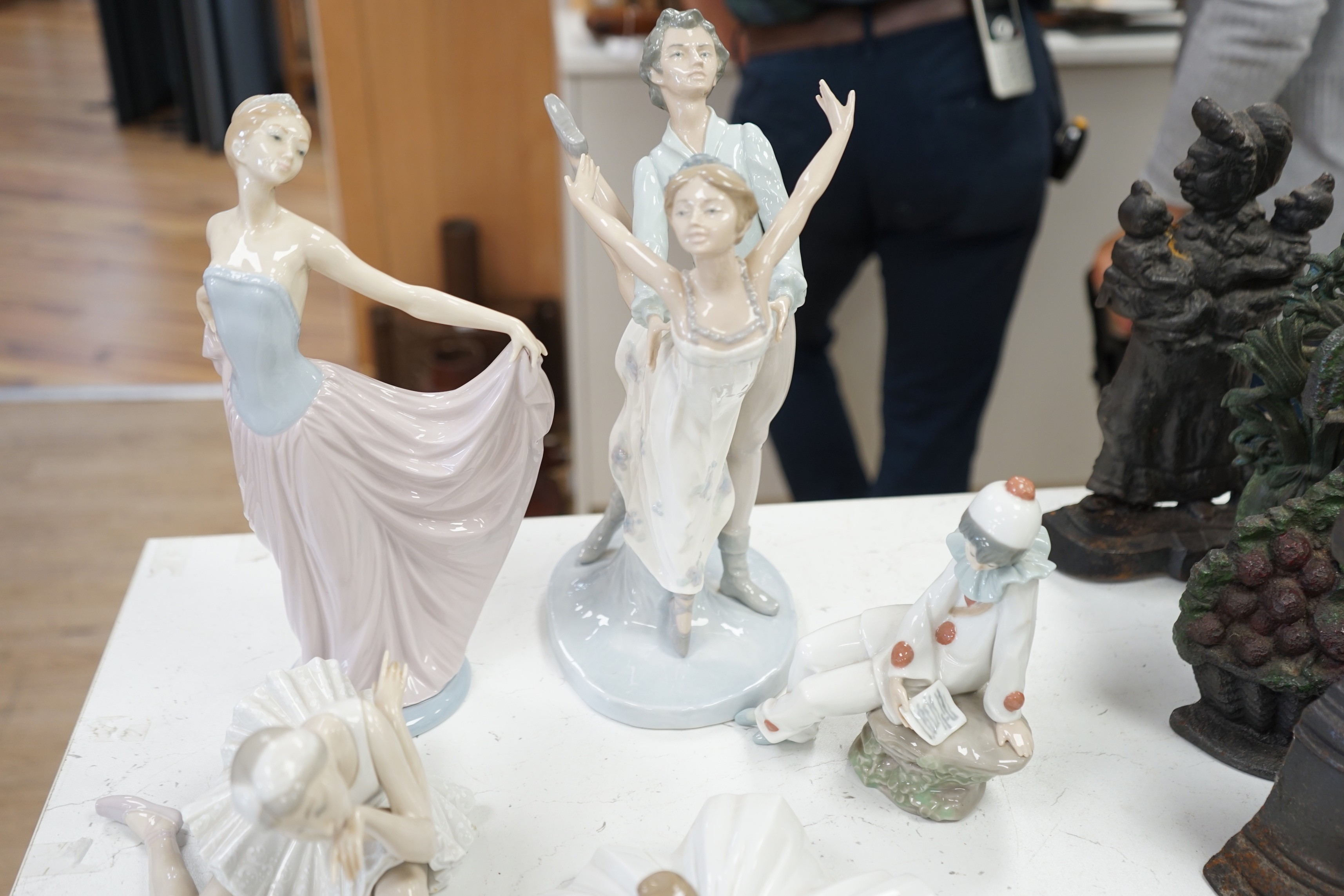 Seven various ceramic figures including Lladro, Nao and Doulton, tallest 33cm